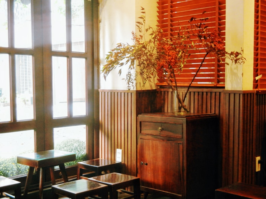 A wooden interior with plants and slatted blinds